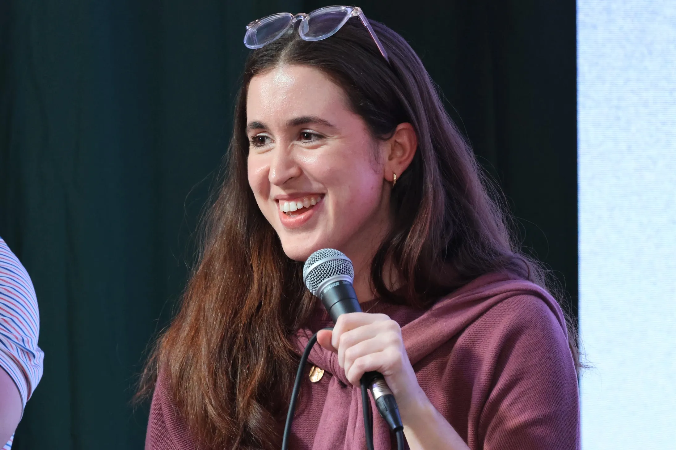 Catherine McMillan speaking with a microphone